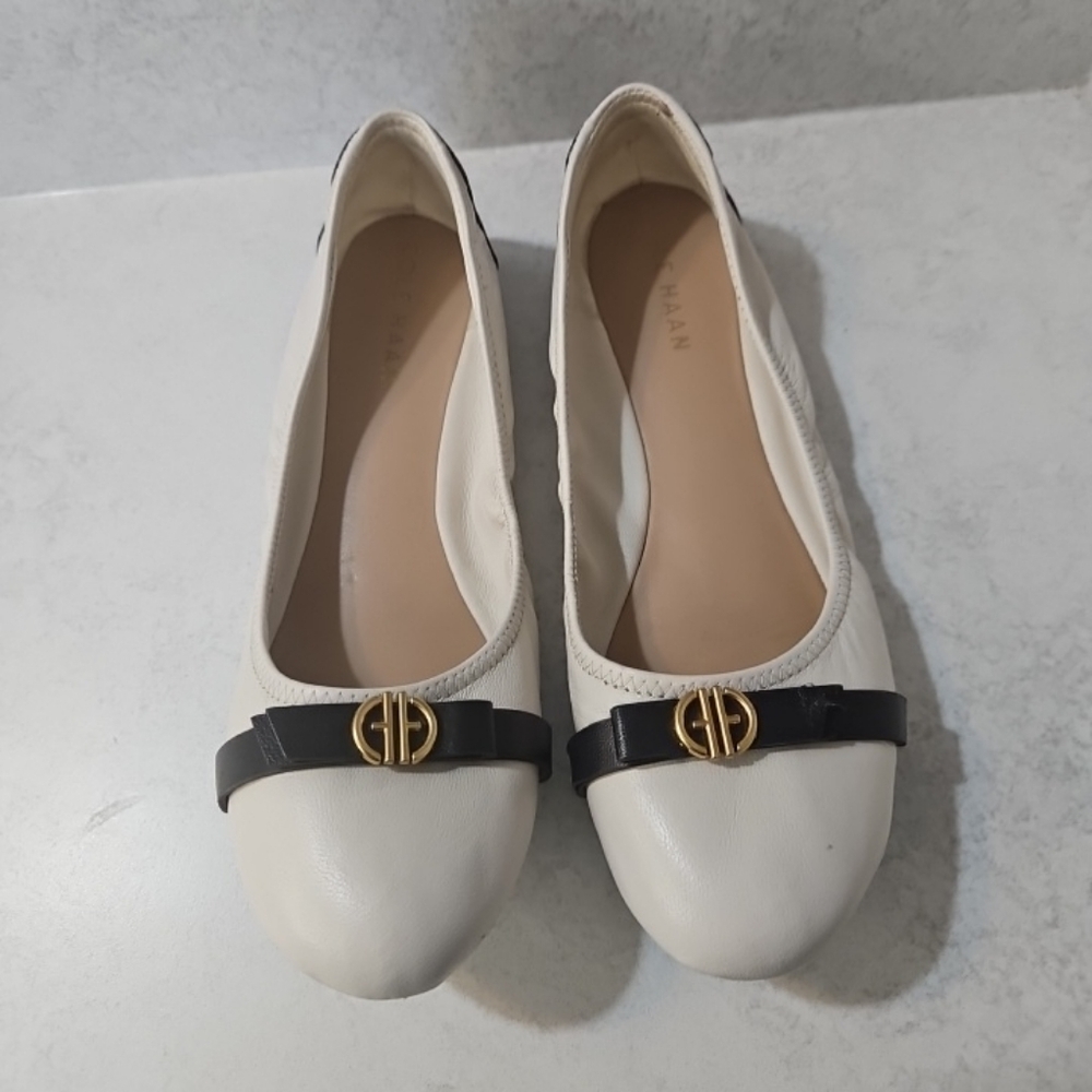 Cole Haan Off White Leather Ballet Flats with Black Strap and Gold Emblem